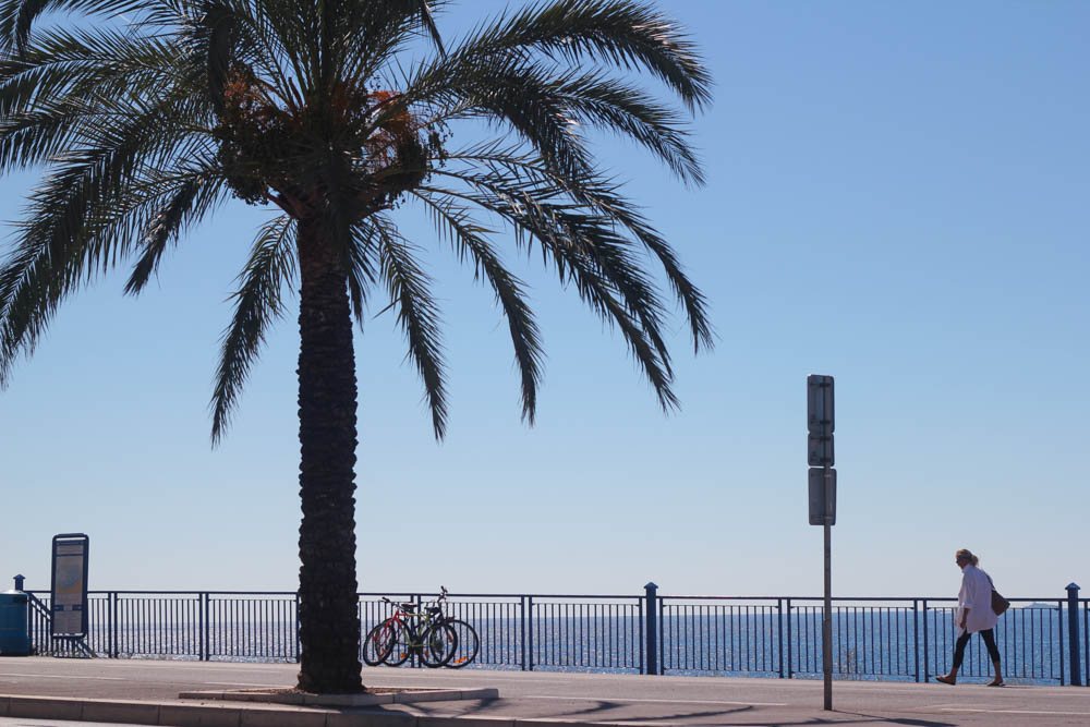 Woman walking along the Promenade des Anglais